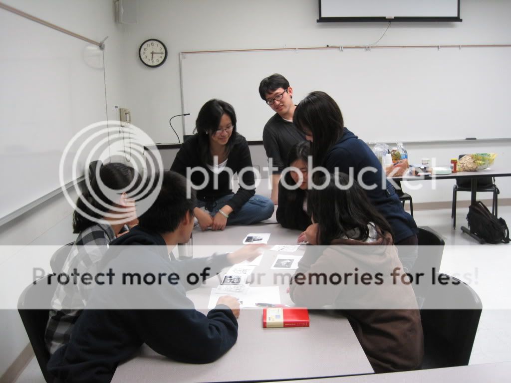 The plot thickens on the other side with the Chinese team of 8, as the group sits around the table and develops an interesting story with all of the pictures laid out across the table.